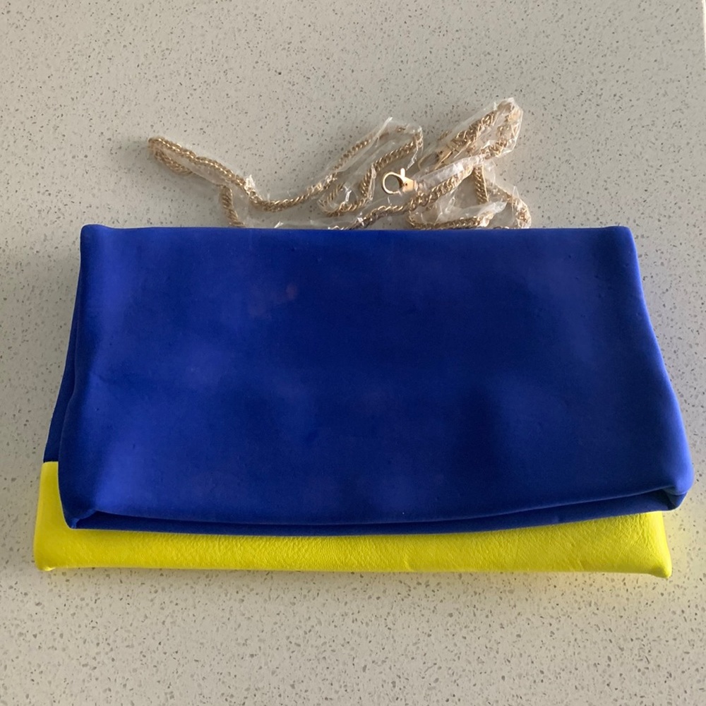 Street level fold over clutch with gold chain